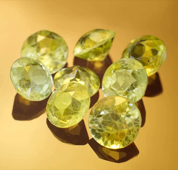 Group of round citrines on yellow background