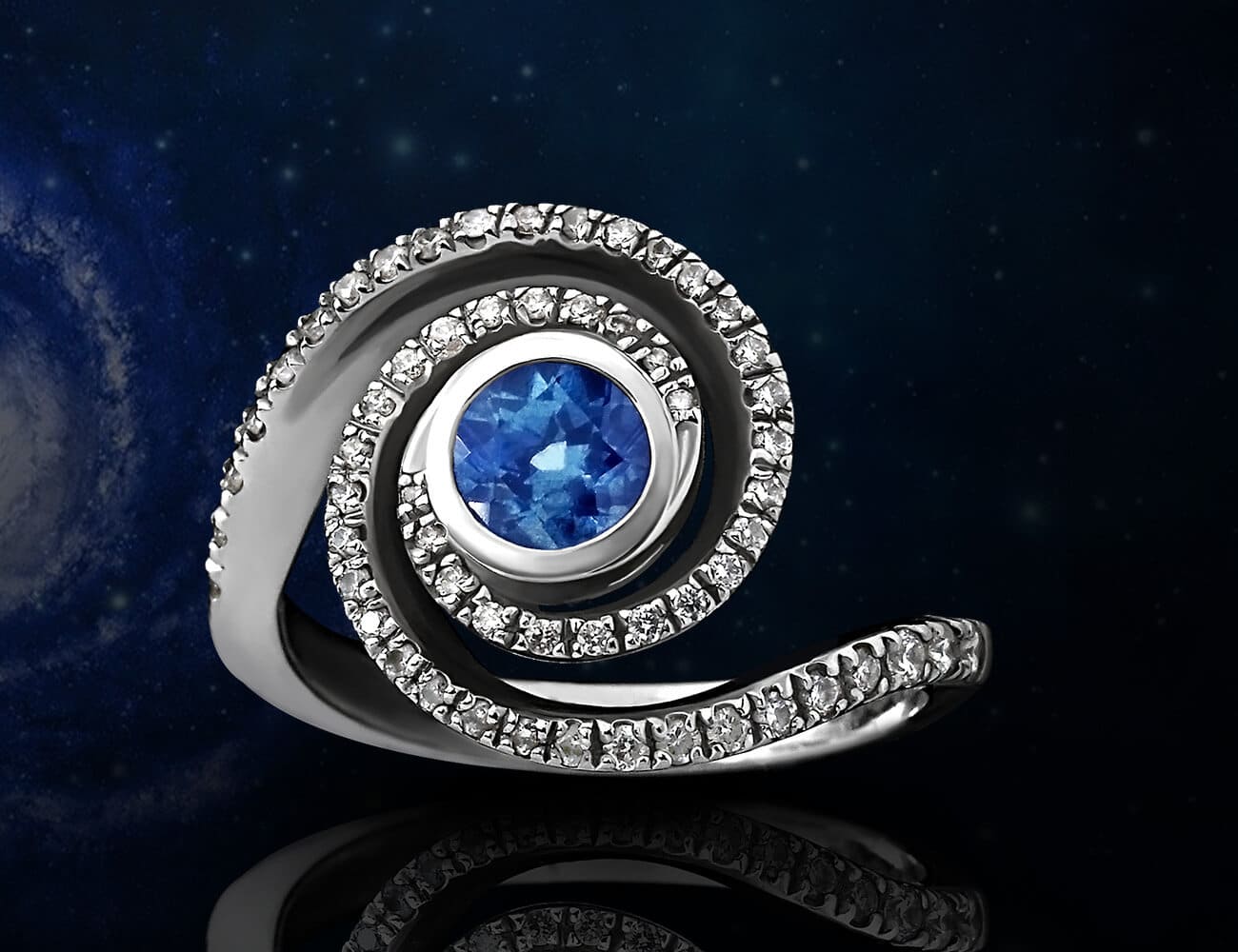 Spiral sapphire and diamond large ring