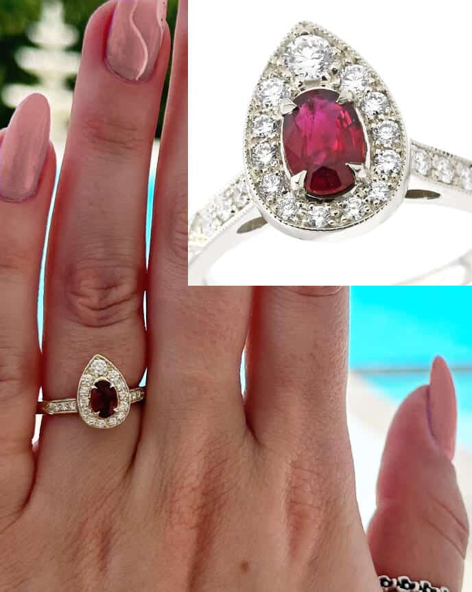 pear shaped ruby halo ring on finger