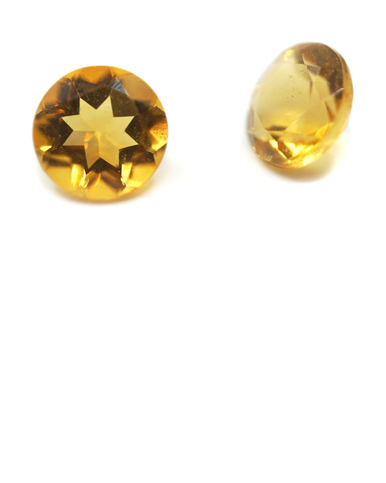 Pair of small round cut yellow citrines