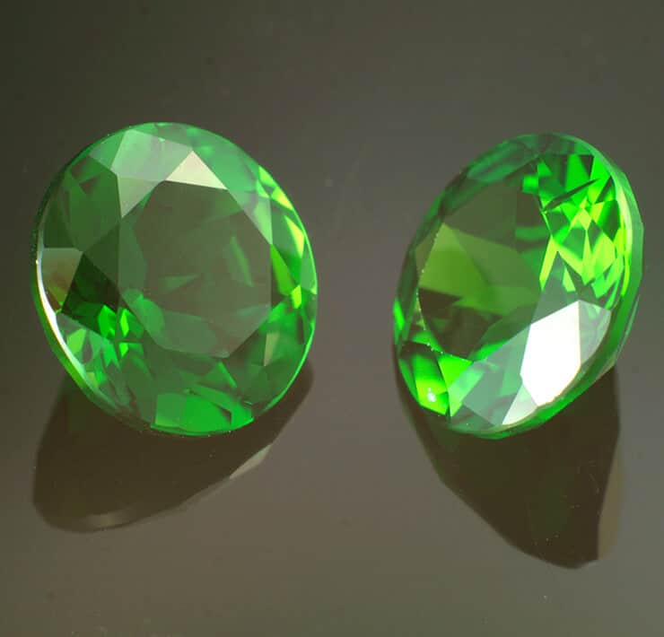 Pair of round green peridots