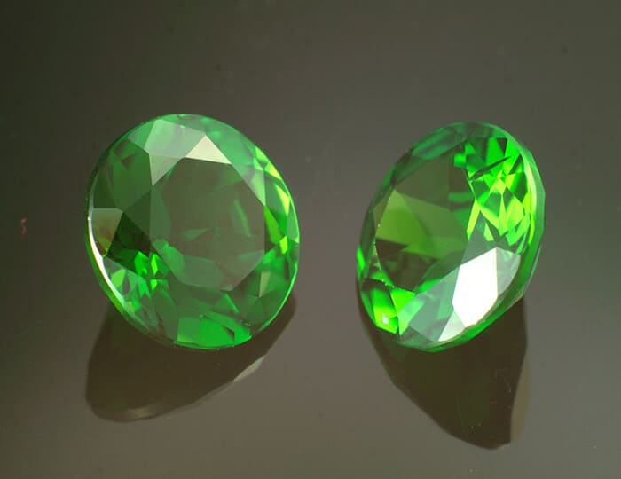 Pair of green round peridots