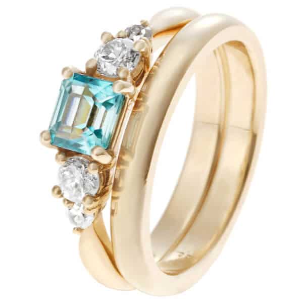 gold wedding set with blue zircon and diamonds