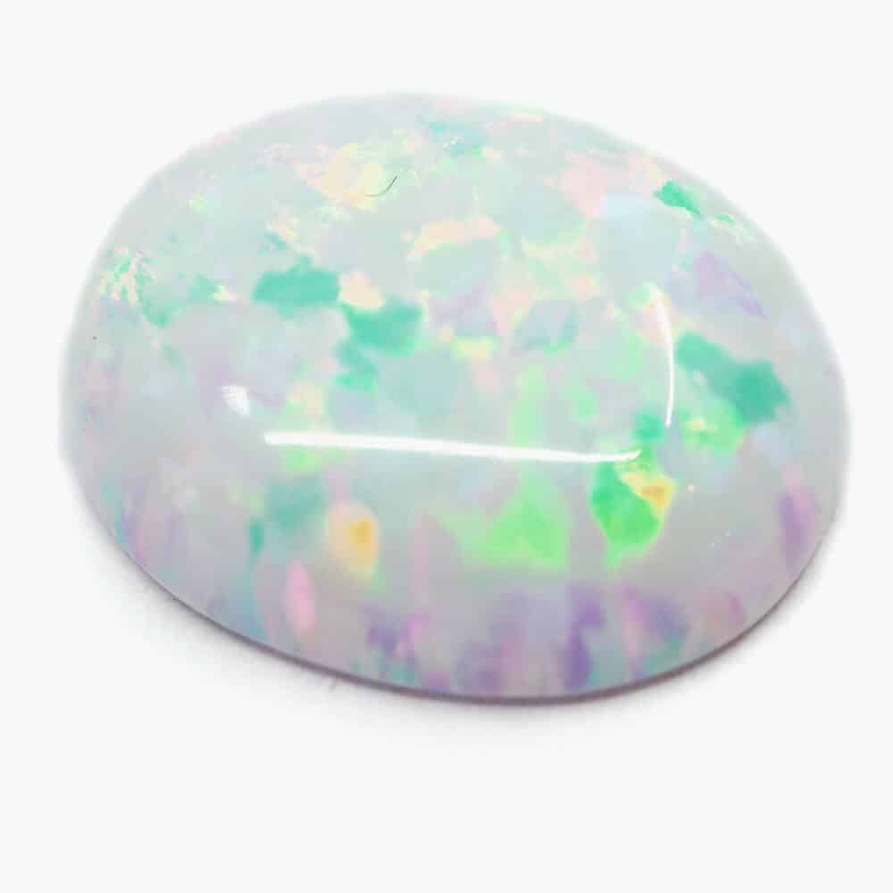 white laboratory grown oval cabochon opal