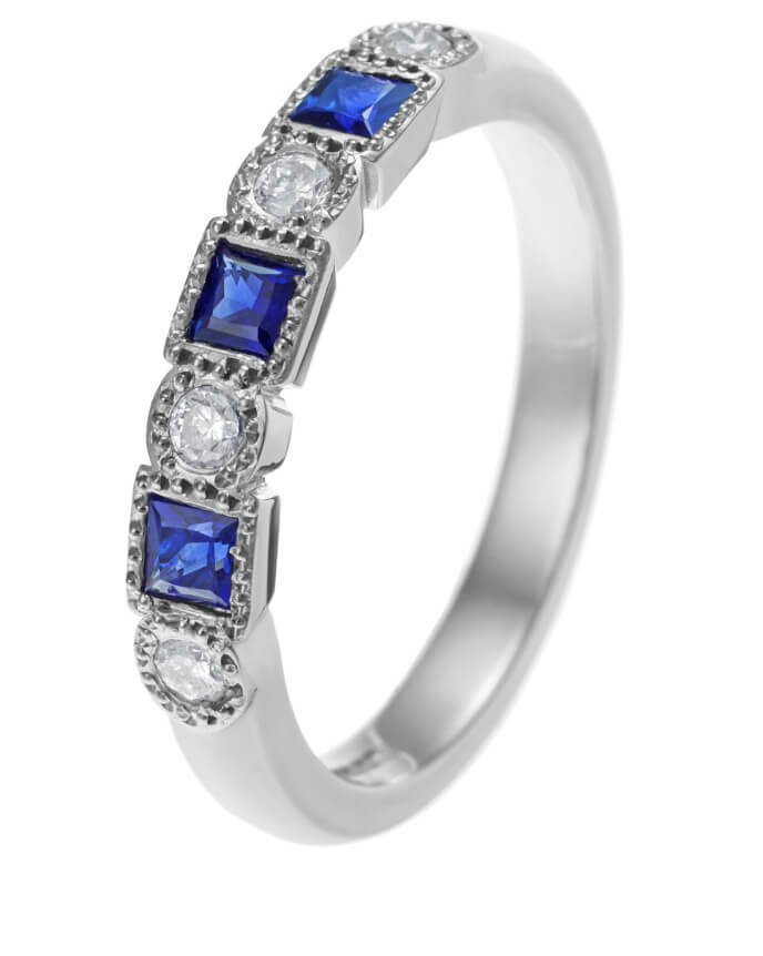 blue sapphire and diamond alternating set eternity ring