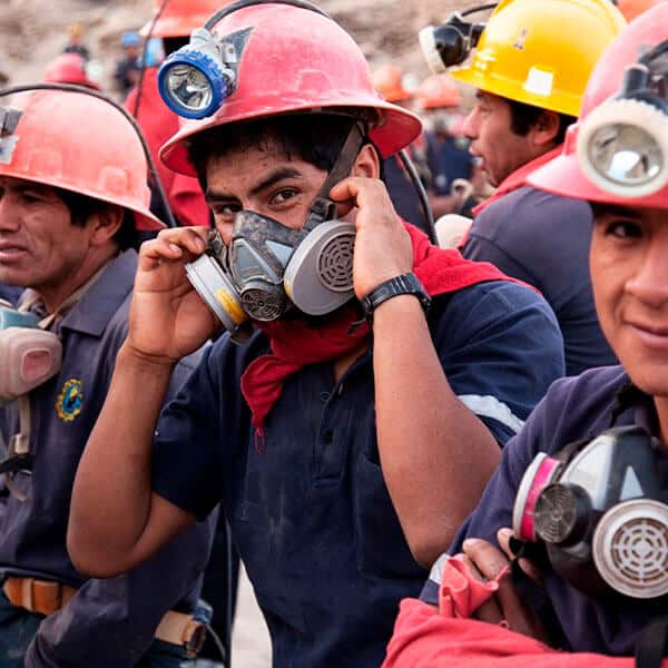 gold miners with helmets and face masks