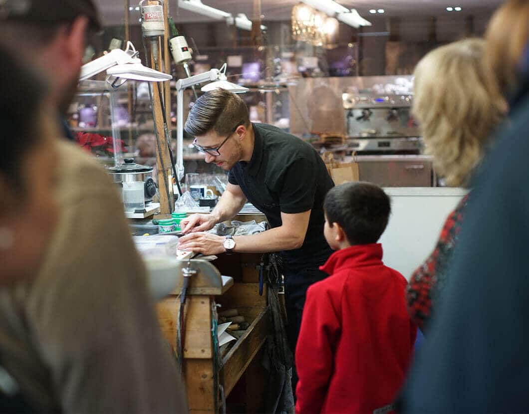 Goldsmith doing jewellery demo with audience