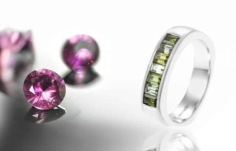 pink and green tourmalines with channel set eternity ring