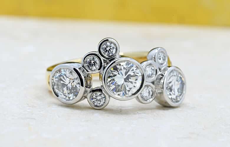 large scatter set round diamond eternity ring