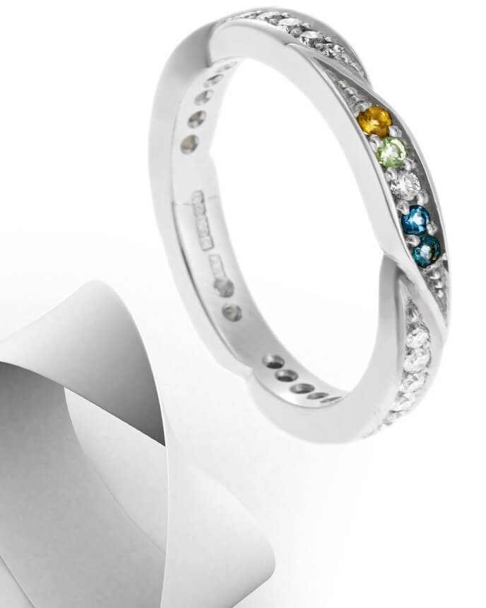 mobius twist shaped gemstone eternity ring