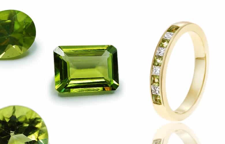 peridot and diamond half eternity ring with loose gems