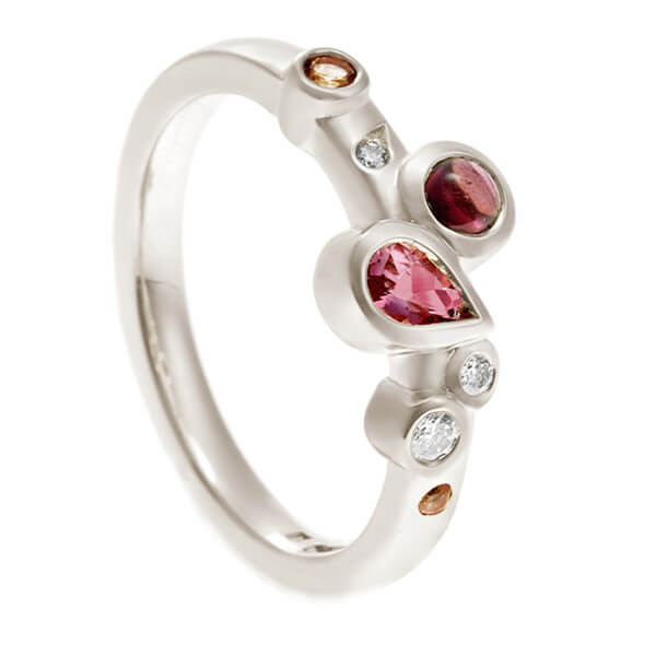 peach tourmaline eternity ring