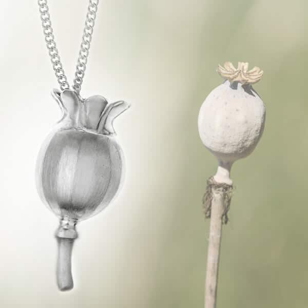 poppy seed head shaped silver pendant with poppy head