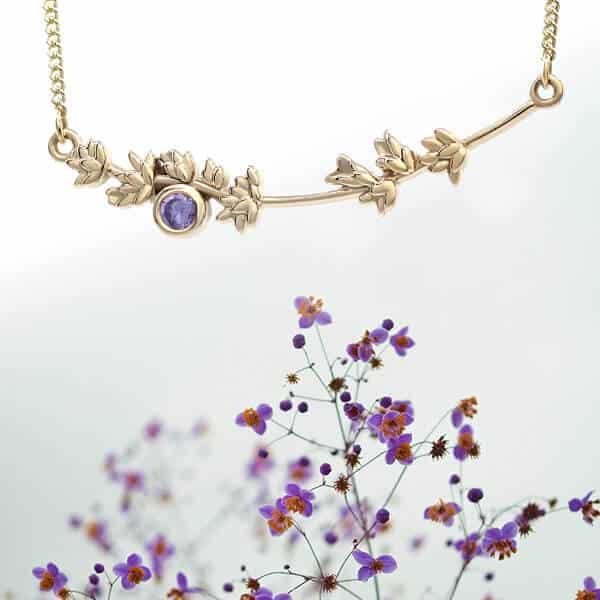 long flower pendant with spray of purple flowers