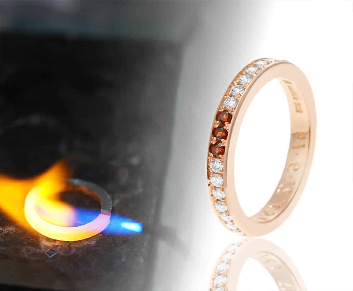 garnet and rose gold wedding ring with blow torch