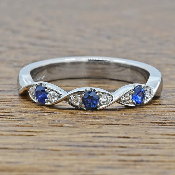 alternating sapphire and diamond platinum eternity ring