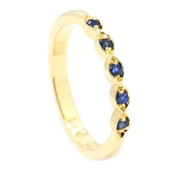 Sapphire gemstone wedding ring in gold