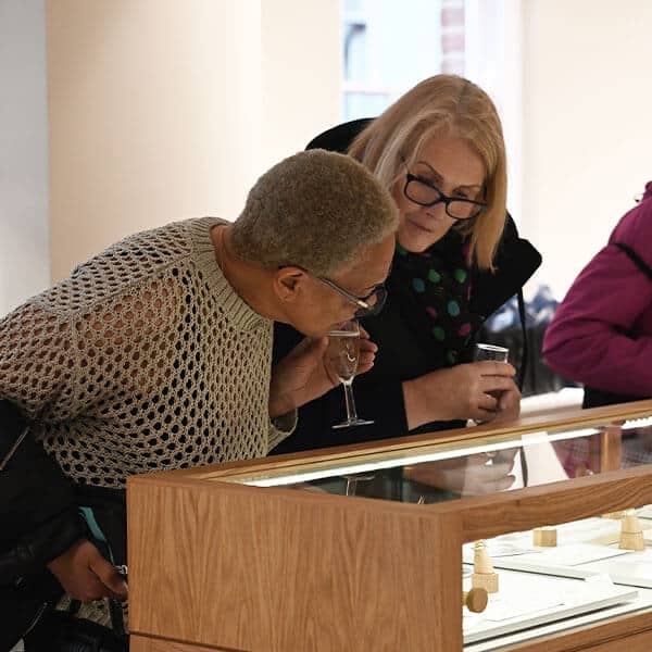 Woman browsing jewellery cabinets