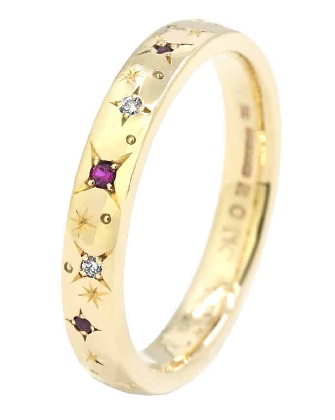 Star set ruby and yellow gold wedding ring