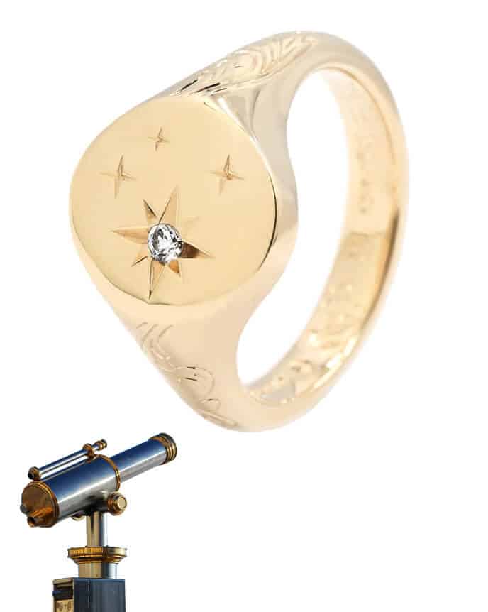 star engraved diamond signet ring with telescope