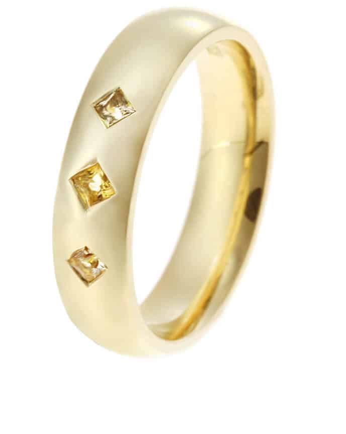 three yellow topaz in gold ring