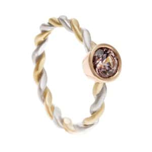 Yellow and white gold twisted band with gemstone