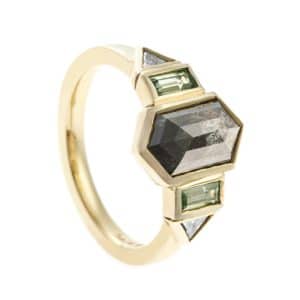 Art deco ring design black and green gemstones