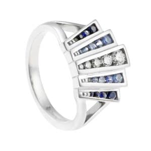 Fan shape ring with blue and white gemstones