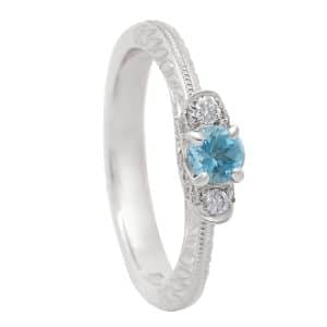 Detailed engraving ring with diamond and aquamarine