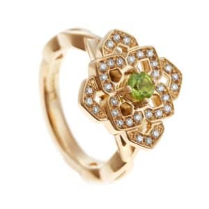 Ornate floral gold ring with peridot