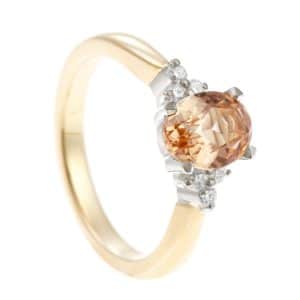 Pale imperial topaz in white metal ring