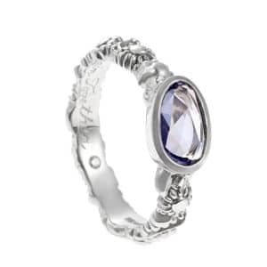 white metal floral ring with sapphire