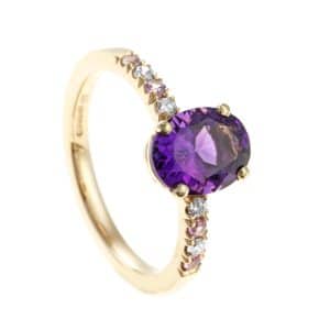 Gold ring with oval amethyst and diamonds