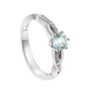 Sky blue gemstone in white metal ring