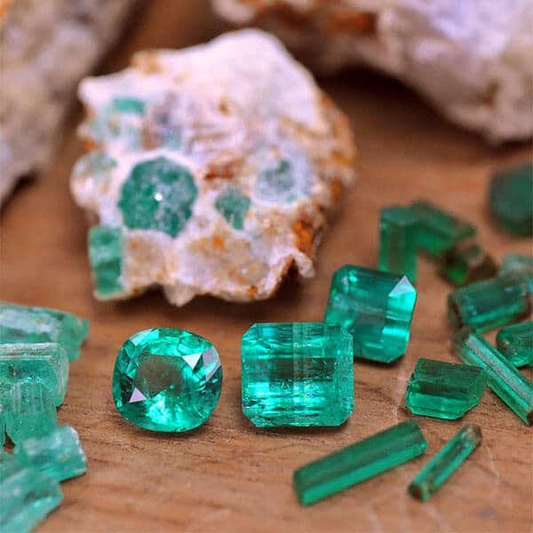 pile of loose emeralds and rocks