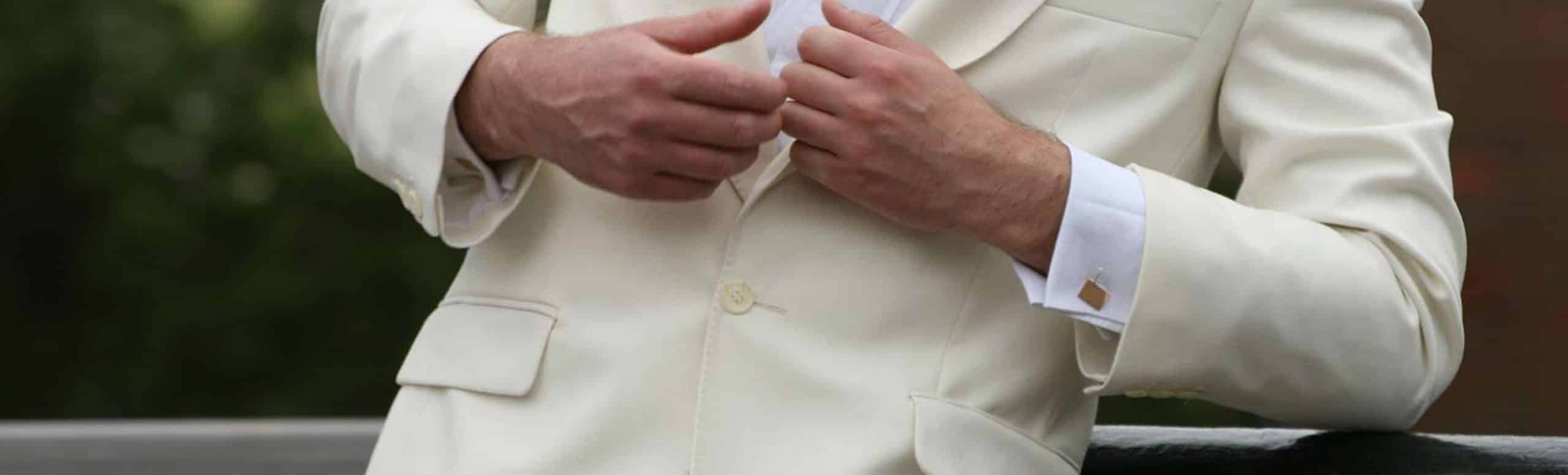 gold cufflinks on man in tuxedo