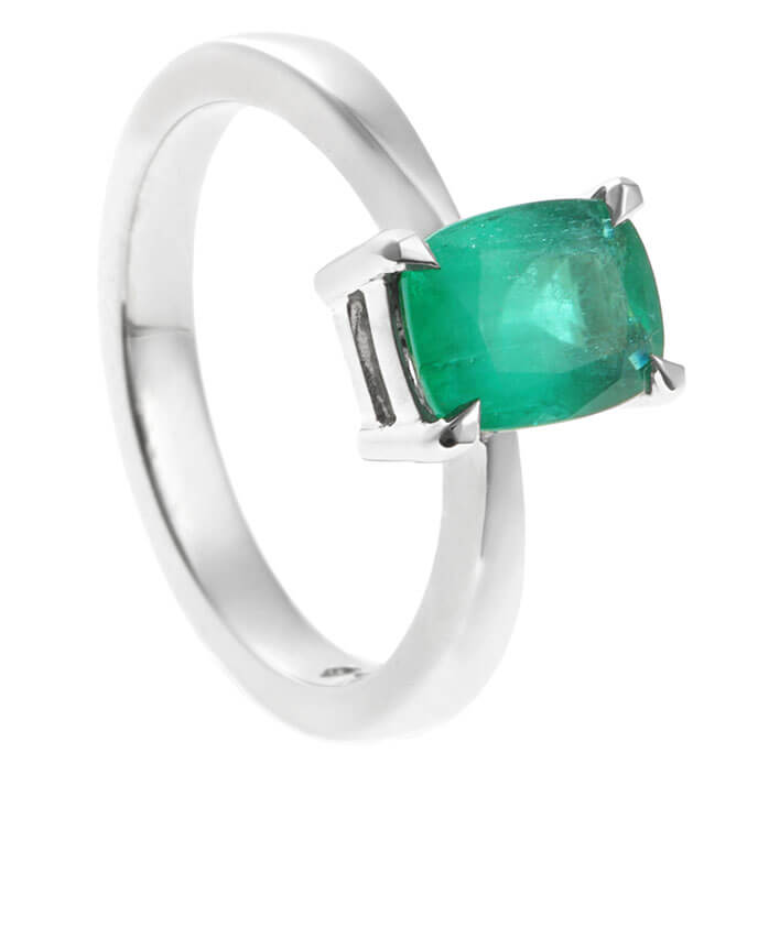 cushion cut green emerald and platinum ring