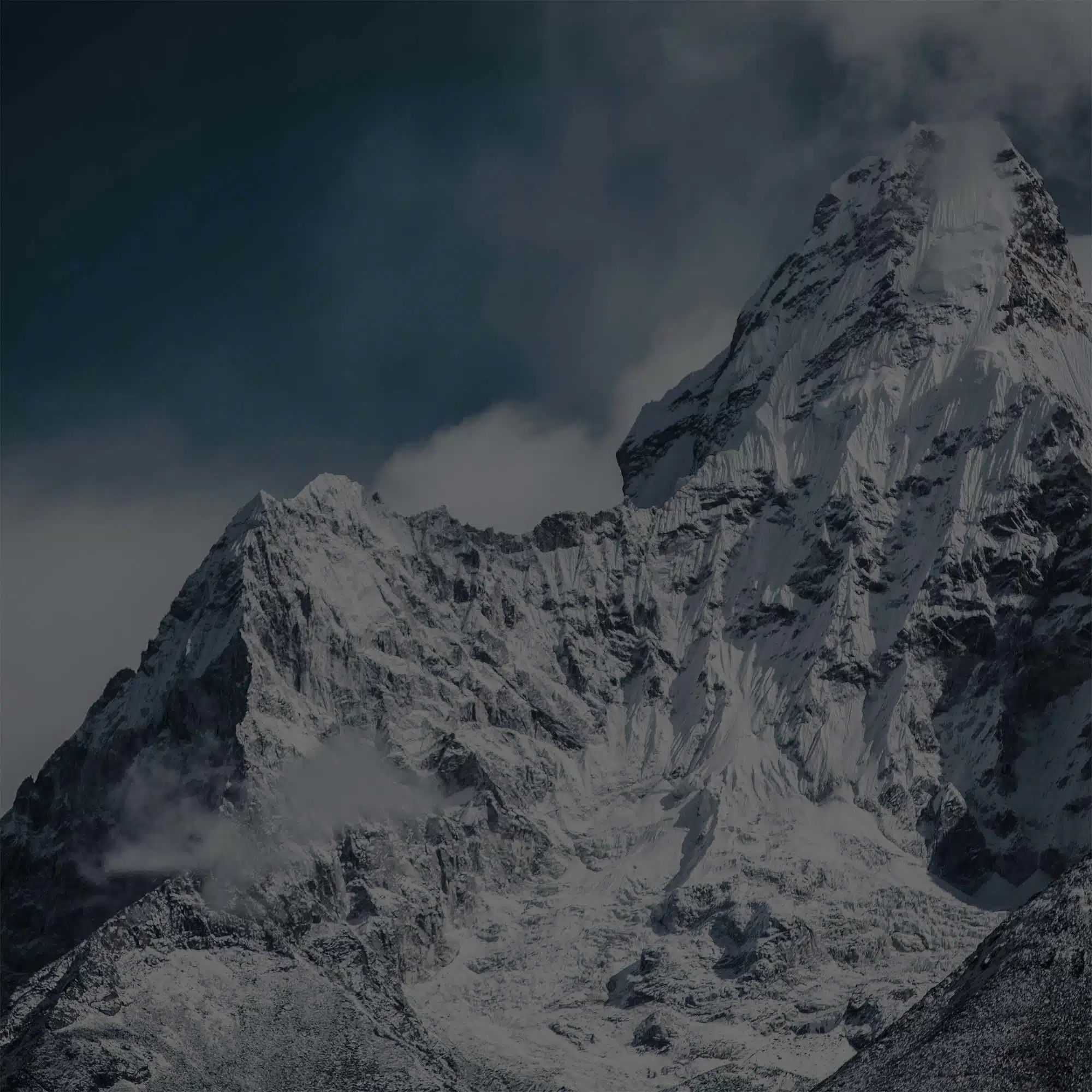 Mount Everest background with the peak and a blue cloudy sky behind