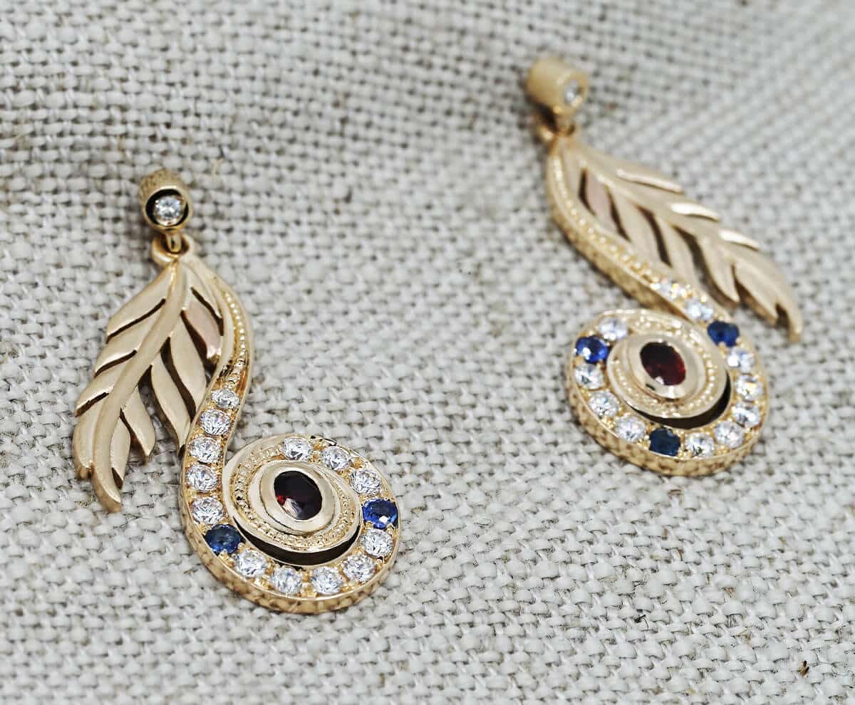 drop earrings with bird shaped detail