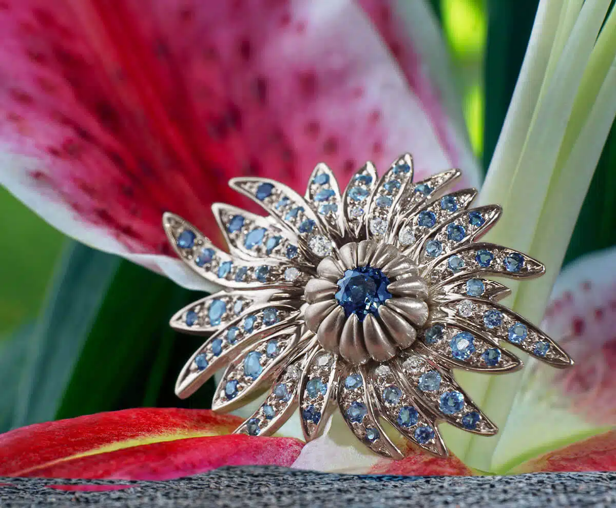 Statement blue sapphire flower ring on lily