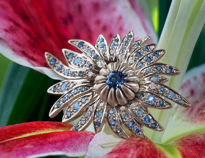 Blue Sapphire Flower Ring on a Red Flower