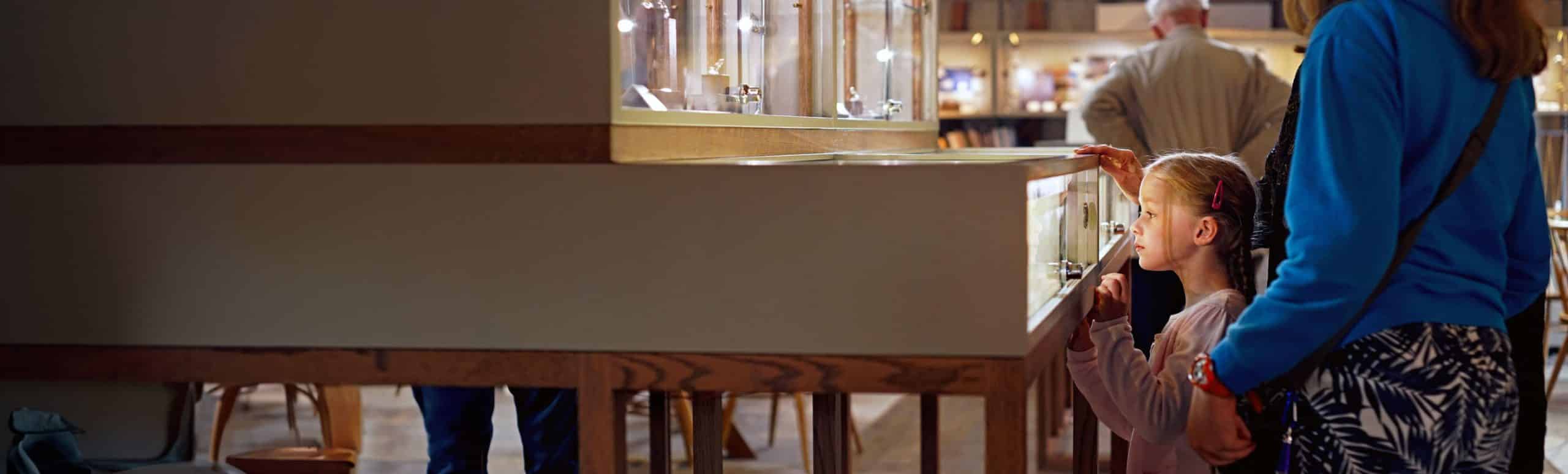 child looking into jewellery cabinet