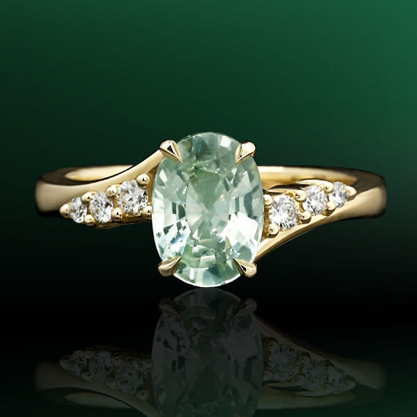 oval green sapphire and gold engagement ring