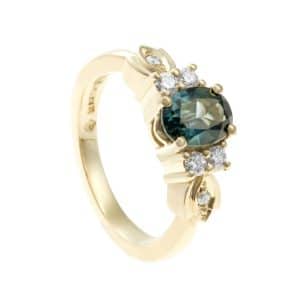 Green sapphire ring with gold leaves