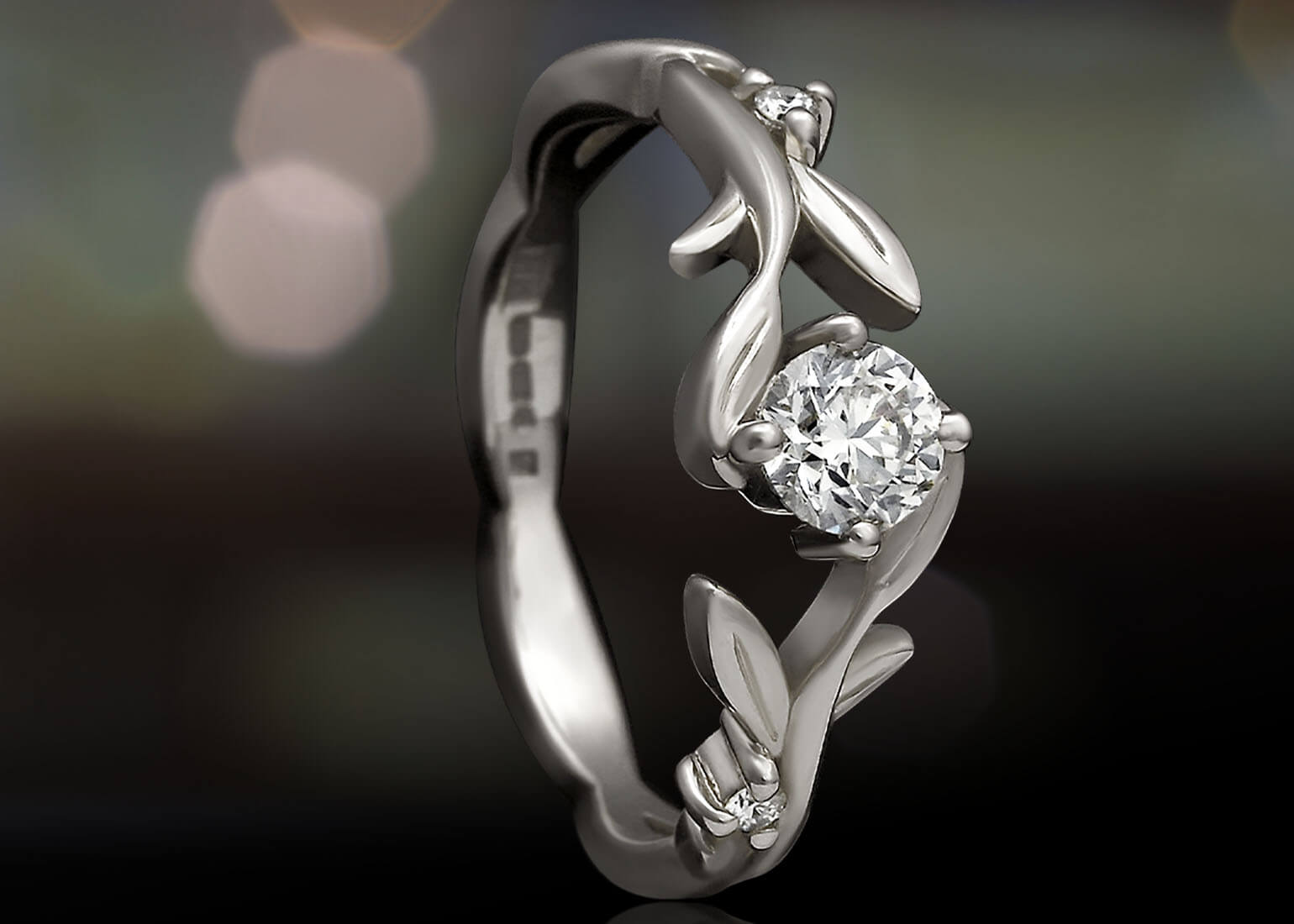 Leaf shaped white gold and diamond engagement ring