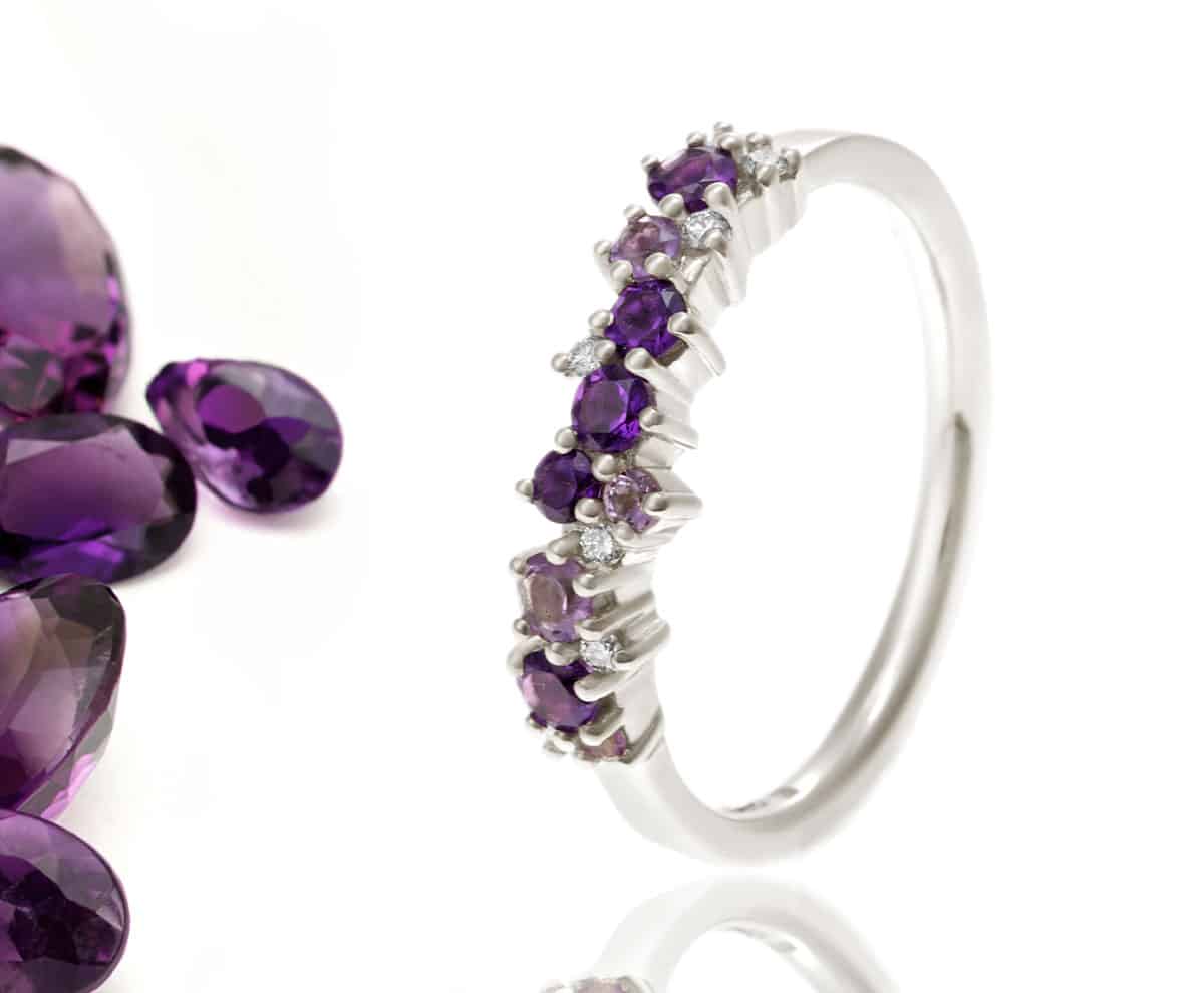 loose gemstones and amethyst ring