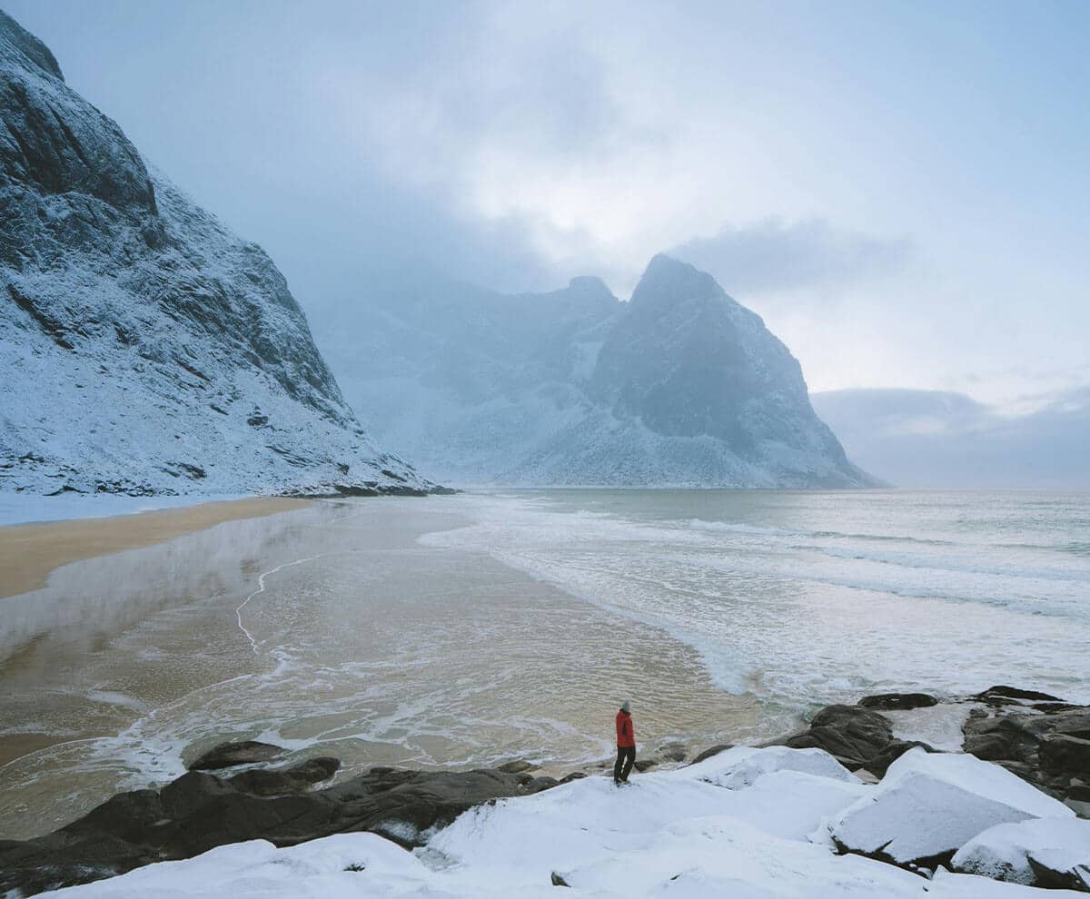 snowy mountain and coastal scene