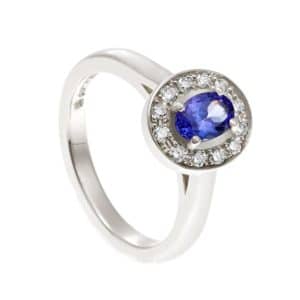 Halo ring with blue stone and diamonds