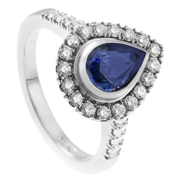 pear shaped sapphire halo style engagement ring