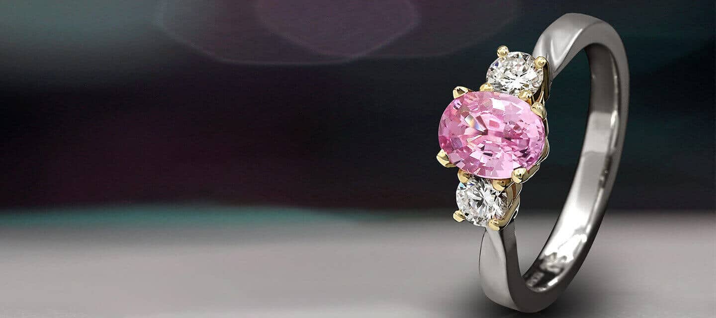 Upright trilogy ring with pink gemstone and diamonds